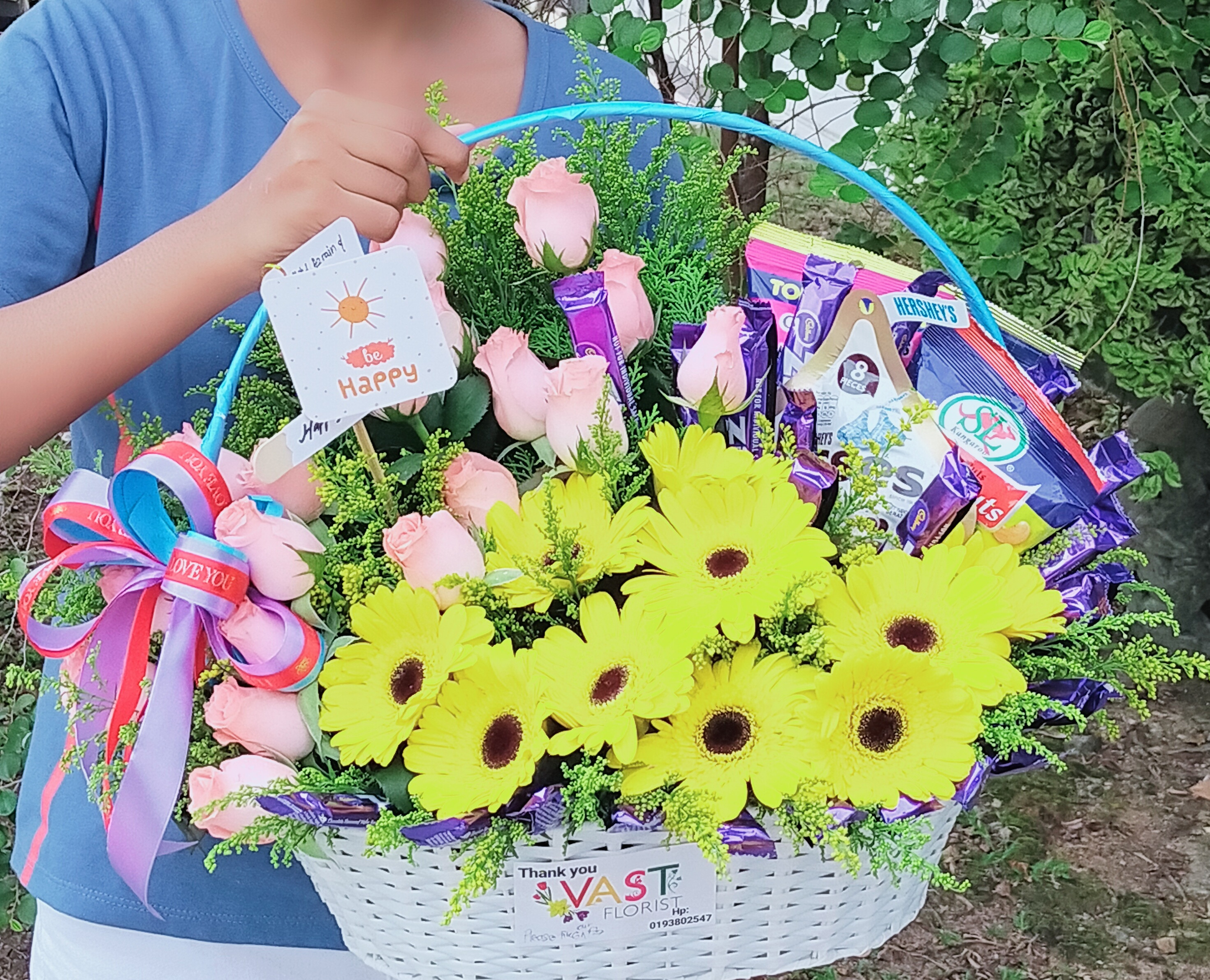 Sweet peach Roses combination off yellow gerbera and mix chocolate with gift basket